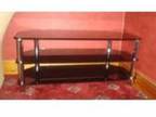 black glass tv stand. w, 1140mm d,  450mm h, 500mm. black....